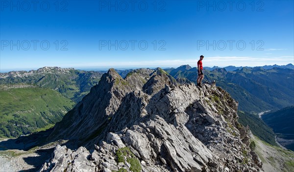 Hiker stands on rocks