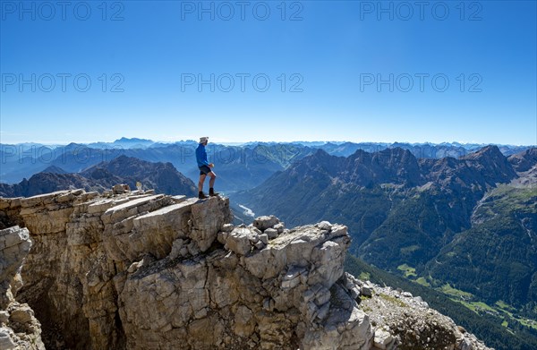 Hiker at the summit of the Hochvogel