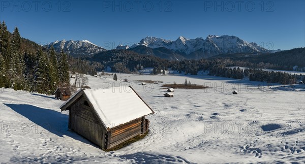 Haystack in snow-covered landscape