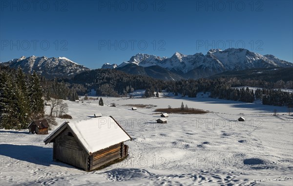 Haystack in snow-covered landscape