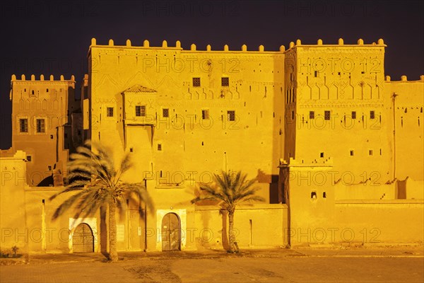 Illuminated Kasbah Taourirt at night