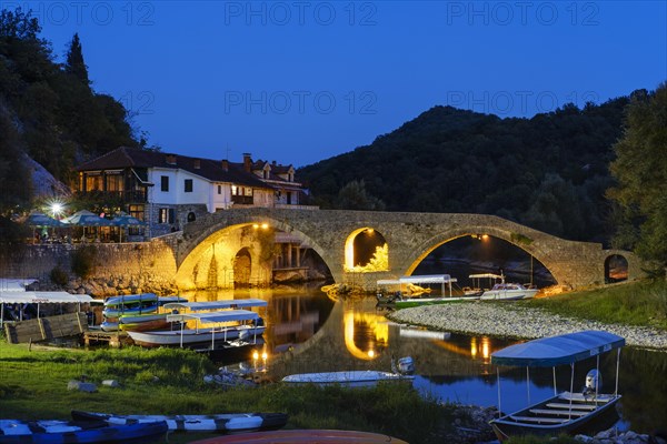 Excursion boats and Old Bridge Stari most at dusk