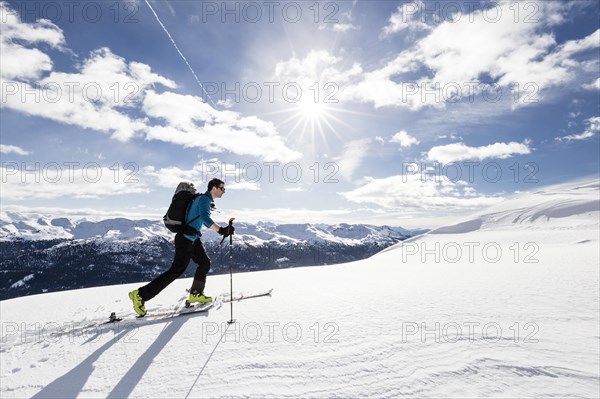Ski tourer on ridge ascending Seeblspitze in Pensertal