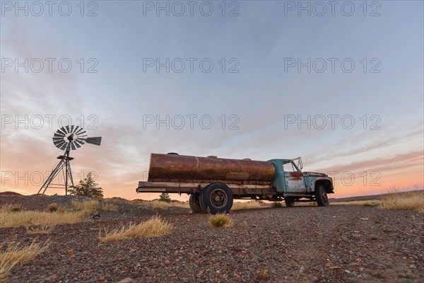 Pampa with old trucks on a farm in Bosques Petrificados de Jaramillo National Park