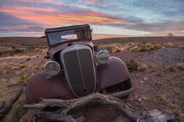 Pampa with old car on a farm in Bosques Petrificados de Jaramillo National Park