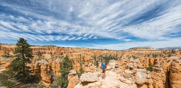 Hiker with backpack in bizarre landscape