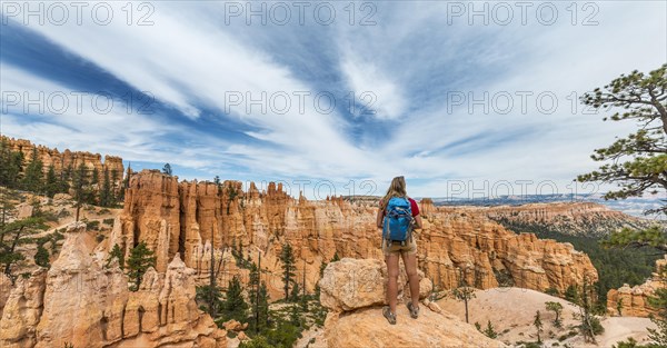 Hiker with backpack in bizarre landscape