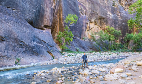 Walker standing in river