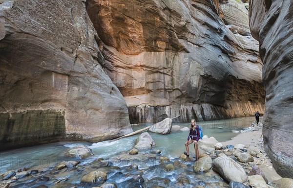 Hiker standing in river