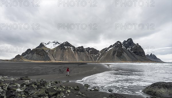 Hiker running on beach