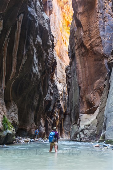 Hiker standing in river