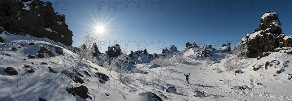 Woman on trail in snowy landscape