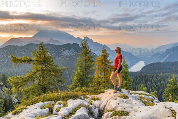 Hiker looks at mountain panorama