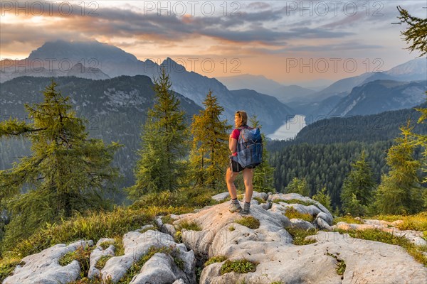 Hiker looks at mountain panorama