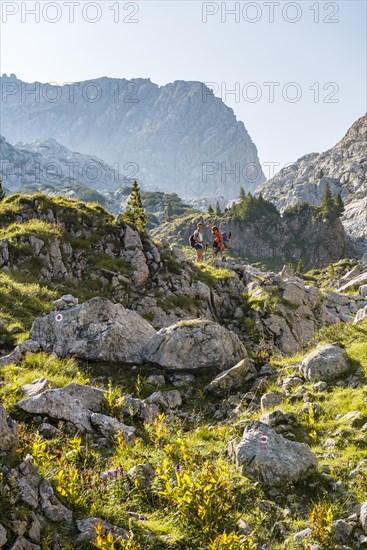 Two hikers on a rock