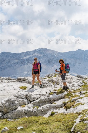 Two hikers look into the camera