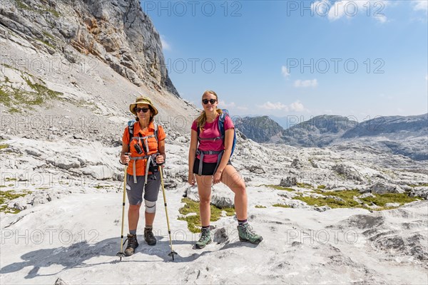 Two hikers look into the camera