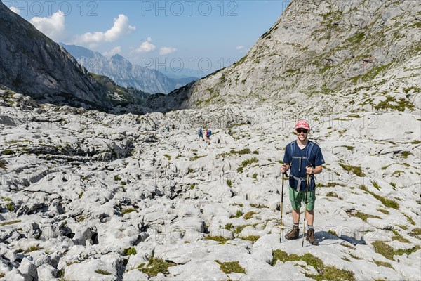 Hiker stands on rocks