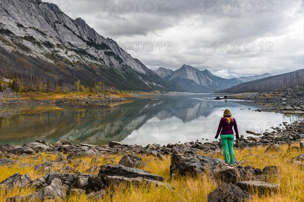 Young woman standing on a rock