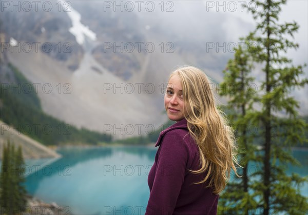 Young woman looks into the camera