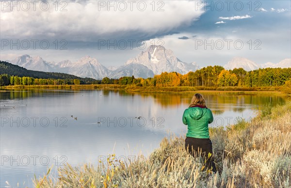 Young woman looking over autumn landscape