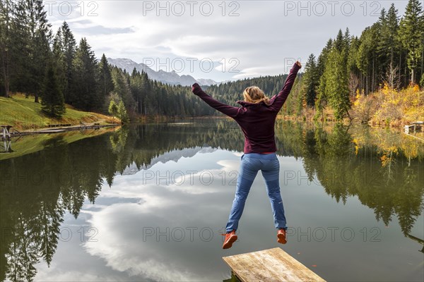 Young woman jumps into the air