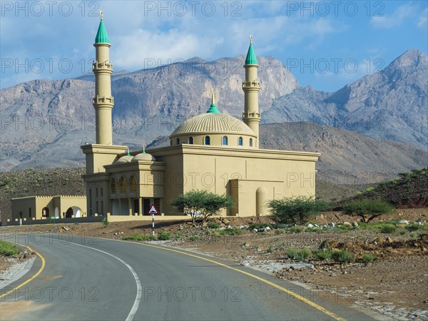 Mosque against mountain chain Jabal Misht