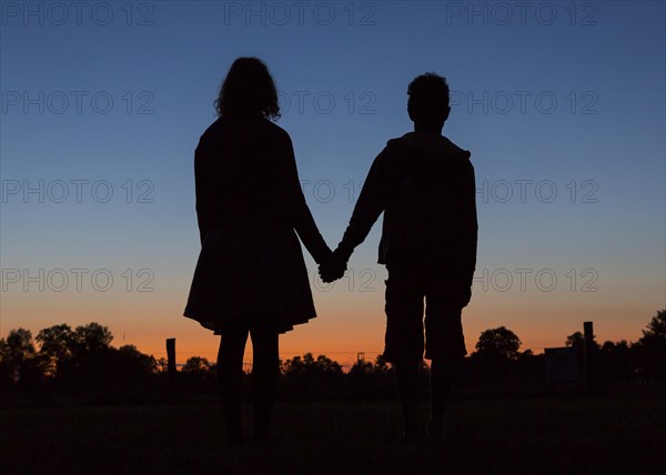 Silhouette in front of evening sky