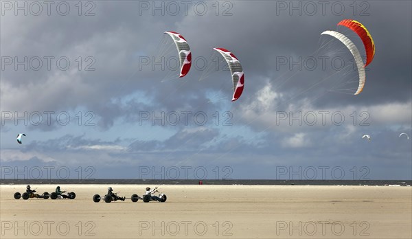 Beach sailer at the sandy beach with wind