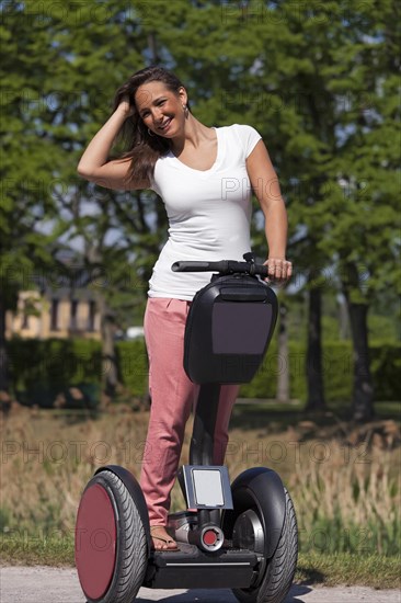 Young woman riding Segway