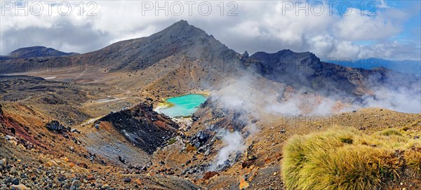 Volcanically active smoky landscape with green Emerald Lakes