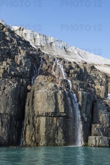 Waterfall in a glacier on Alkefjellet