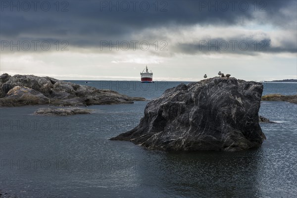 Expedition ship in the rocky bay