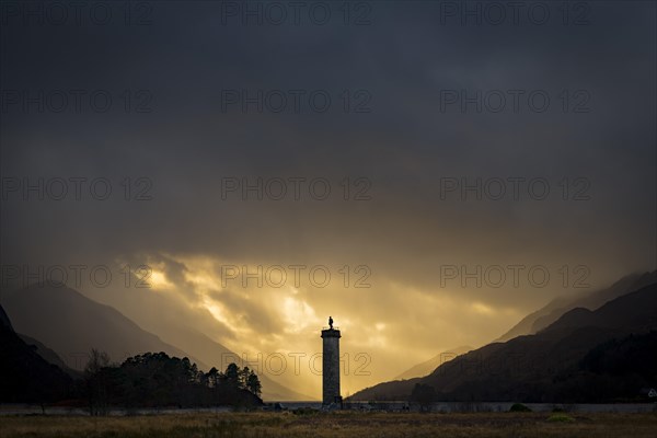 Loch Shiel with Glenfinnan Monument under threatening cloudy sky