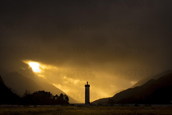 Loch Shiel with Glenfinnan Monument under threatening cloudy sky