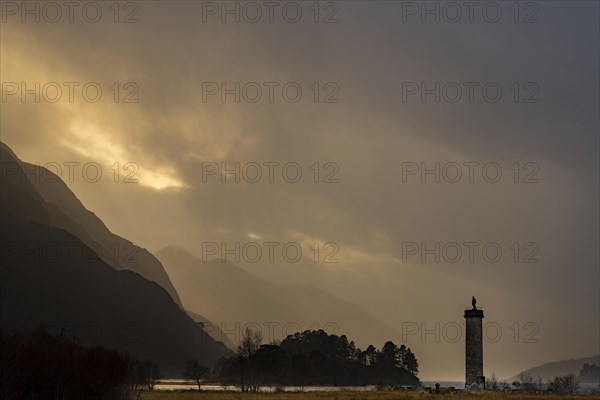 Loch Shiel with Glenfinnan Monument under threatening cloudy sky