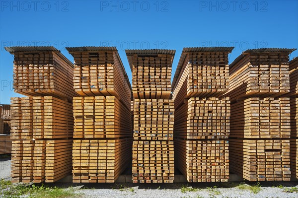 Stacked wooden slats and boards in a sawmill