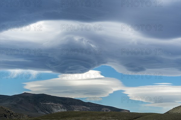 Lenticularis clouds over the mountains at Lago Viedma