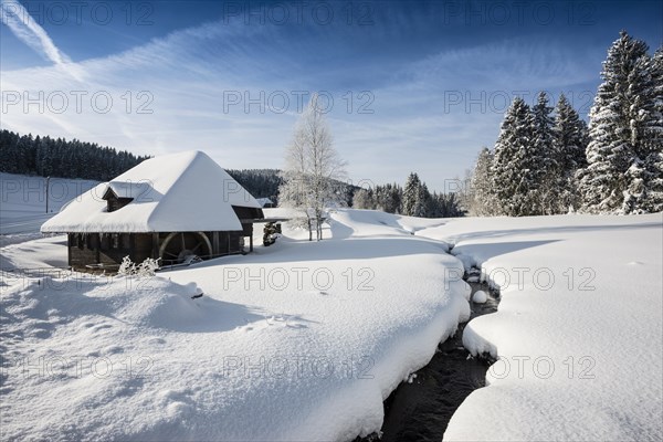 Mill in winter landscape