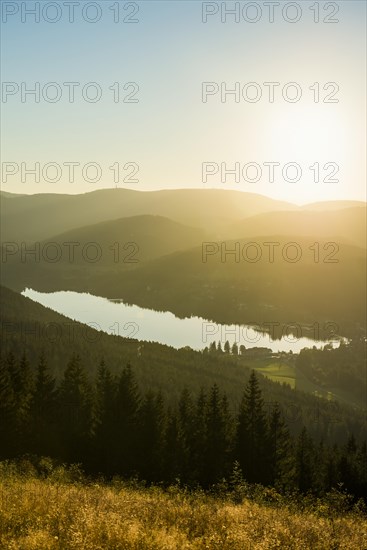 View from Hochfirst to Lake Titisee and Feldberg mountain at sunset