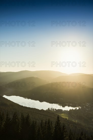 View from Hochfirst to Lake Titisee and Feldberg mountain at sunset