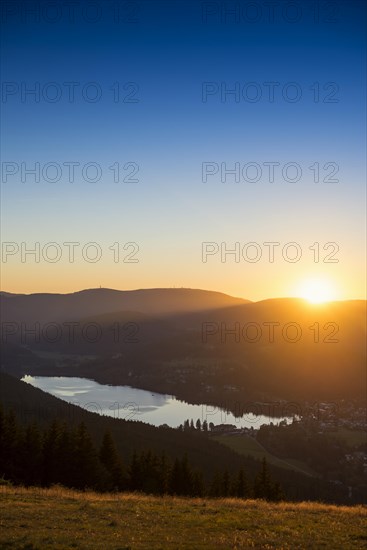 View from Hochfirst to Lake Titisee and Feldberg mountain at sunset