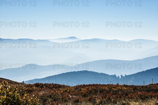 Staggered mountain ranges in the haze