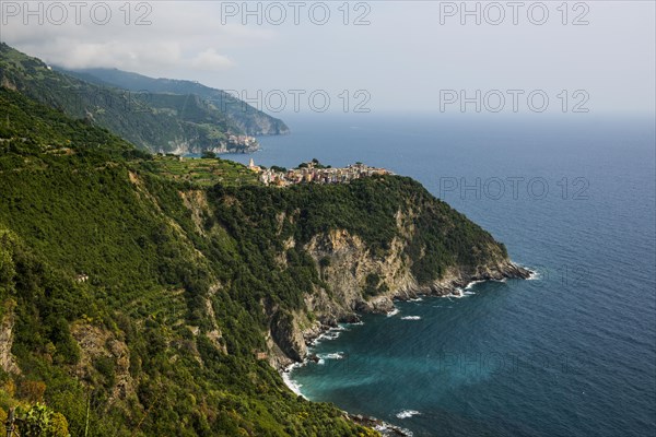 Mountain village with colourful houses on the coast