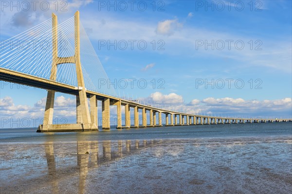 Ponte Vasco da Gama reflecting in the Tagus river