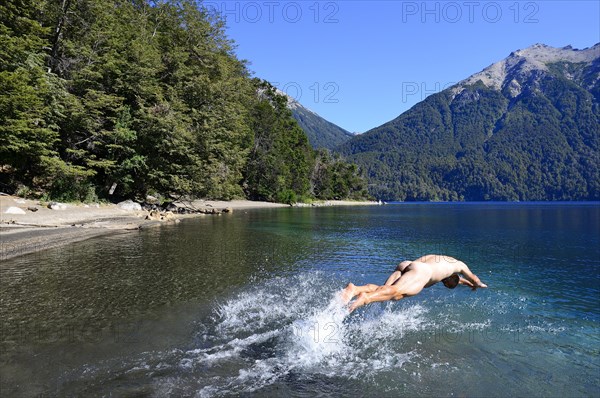 Naked man jumps headlong into cold water