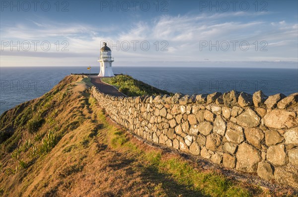 Away with stone wall leads to the lighthouse at Cape Reinga
