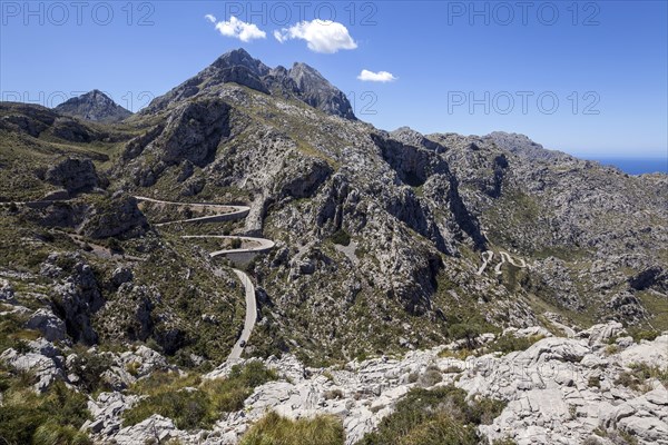 Serpentine road through barren mountains to Sa Calobra