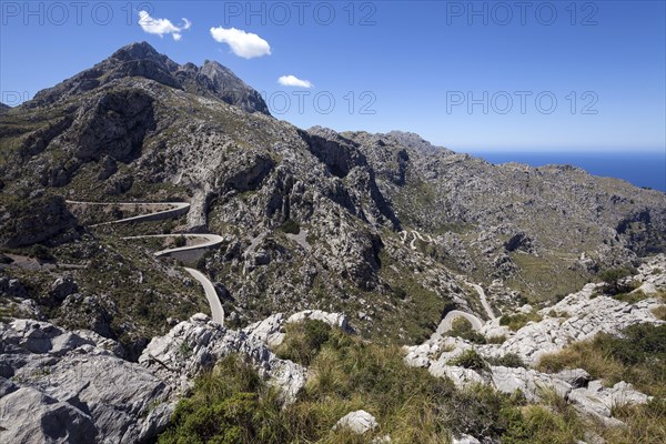 Serpentine road through barren mountains to Sa Calobra