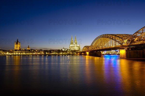Church St Martins and Cologne Cathedral with Hohenzollern Bridge over the Rhine